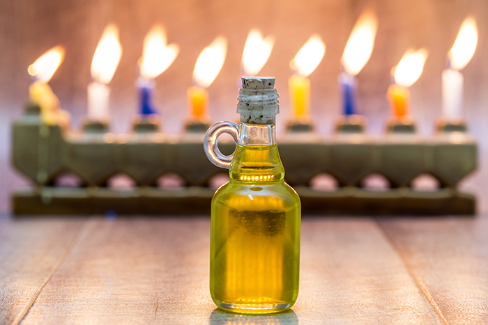 cruise of oil in front of a menorah