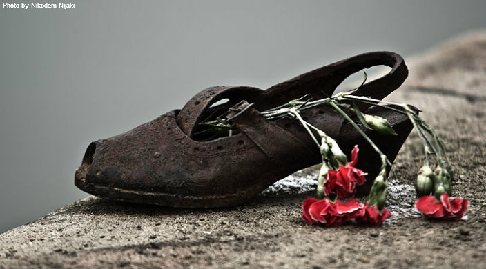Shoe with a wilted flower on it as partof an installation that honors the Jews who were killed by fascist Arrow Cross militiamen in Budapest during World War II